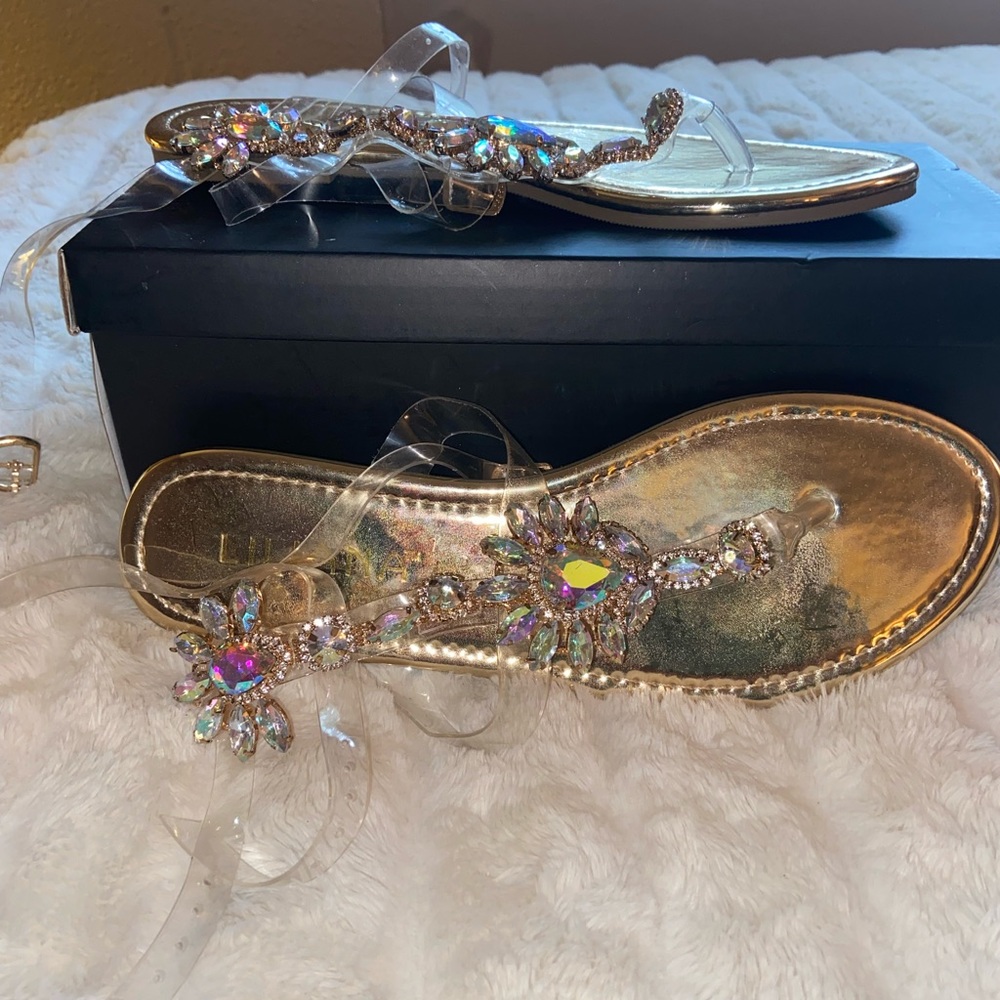 Liliana gold sandals with large rhinestones and clear straps